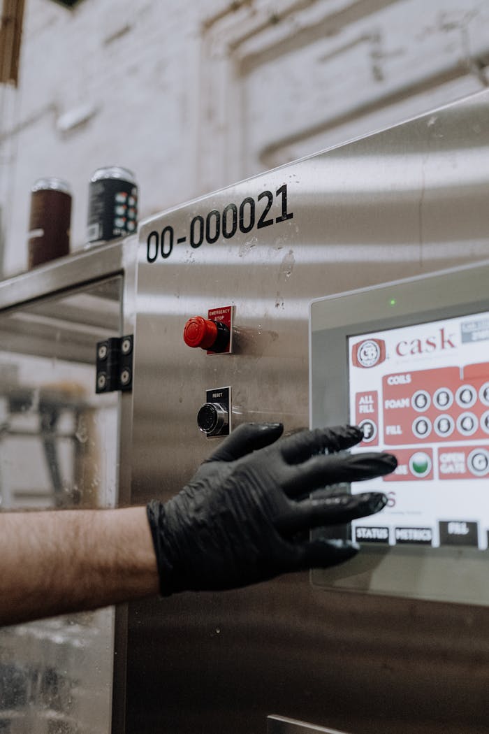 The Art of Drawing Readers In: Your attractive post title goes here Engineer using a touchscreen interface on a metal manufacturing machine.